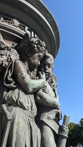 Two infants in Greek clothing on a statue near Berlin Bundestag