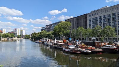 The river Spree is visible on the left side and many old ships are mounted to the land on the right side of the image