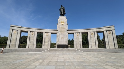 Concrete blocks with a horizontal concrete bar on top are shown and one metal soldier is visible in the center wearing war gear