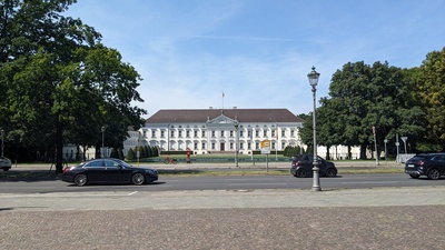 A white wide building is shown