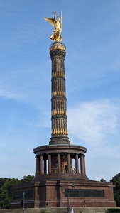 A tall column is shown with a golden figurine “Victoria the Roman goddess of victory” at the top is shown