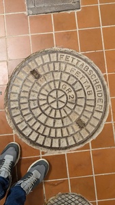 Manhole with text “fat depositor”