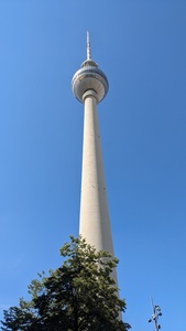 The TV tower is shown in the middle which is obviously a long tall building and has a sphere almost at the top which used to have TV signal equipment and has an observation deck