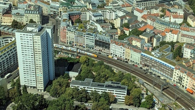 Buildings of Berlin and train tracks go between the buildings